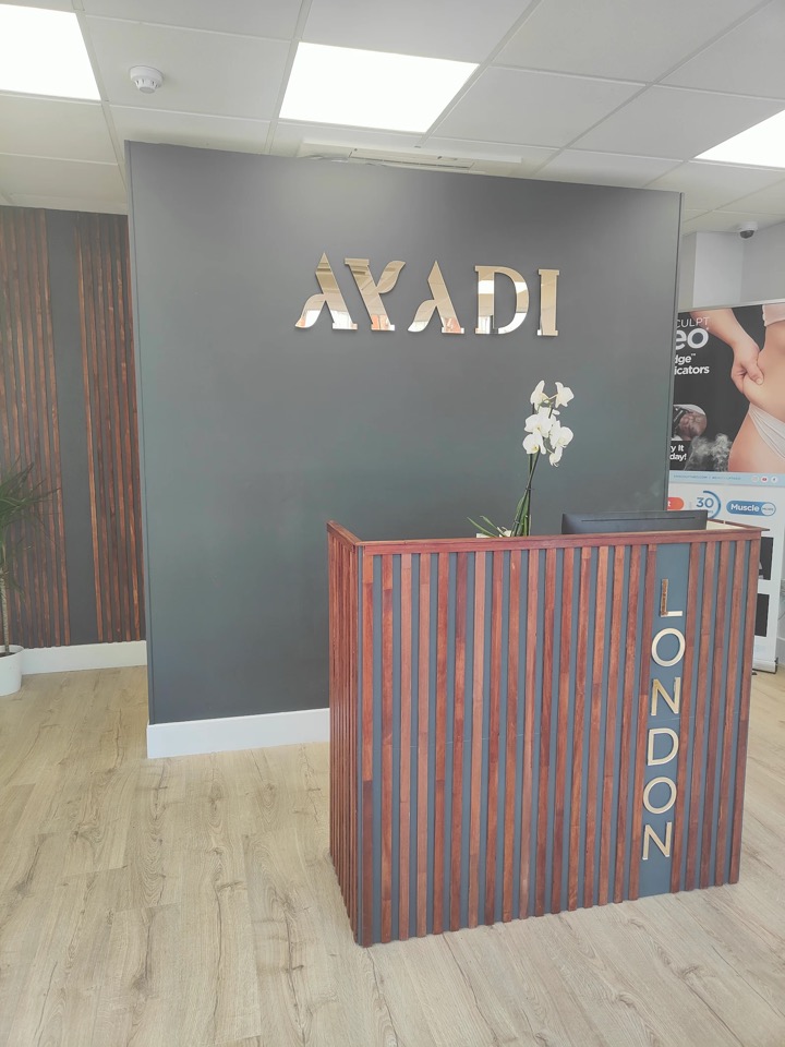Ayadi Beauty and Laser Clinic reception with gold logo in East Finchley